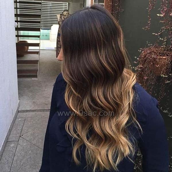 Golden balayage color on dark hair